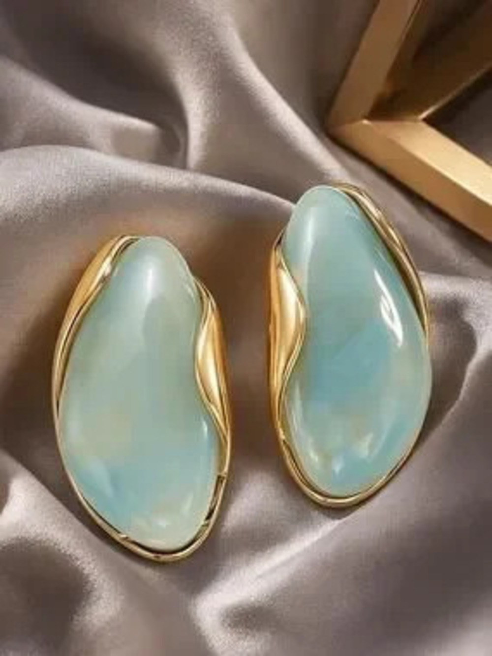 Anthropologie Gold Tone and Aqua Resin Wave Clip-On Earrings